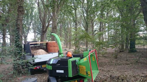 our chipper and truck in a woodland that sussex tree surgeons maintain 